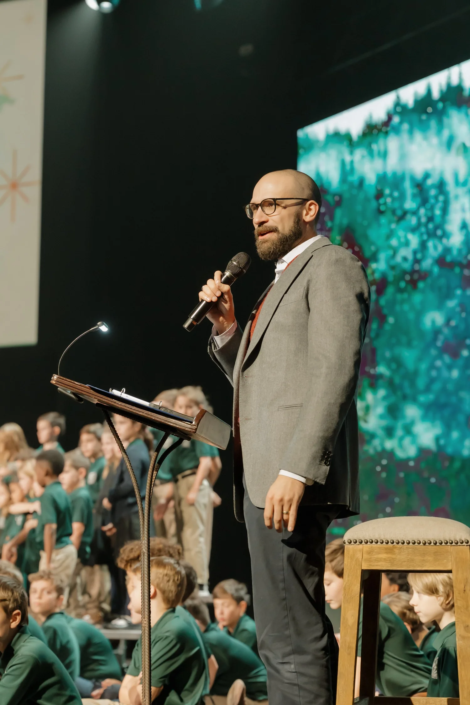 A speaker addressing students at the opening ceremony
