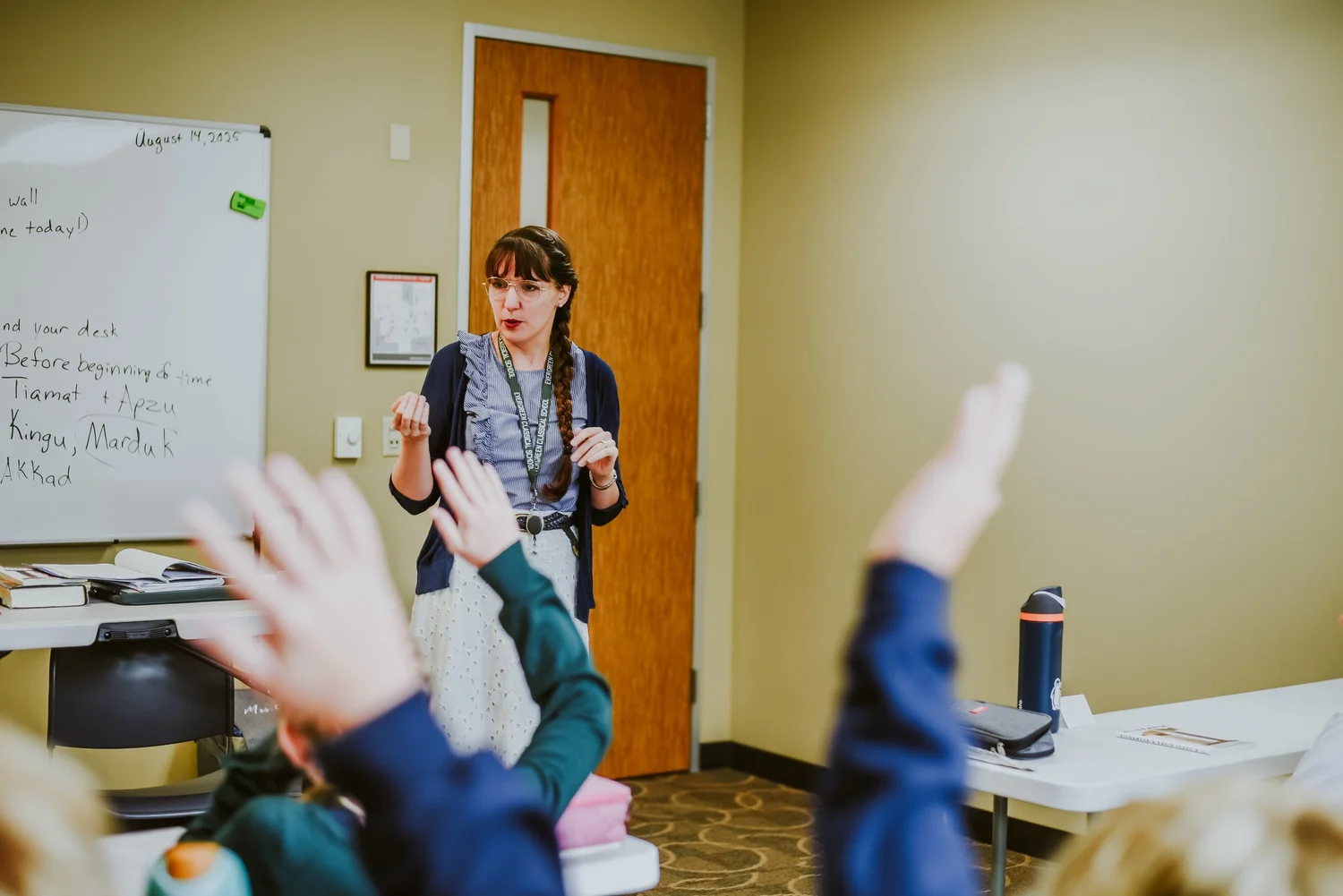 A teacher leading a lesson at the whiteboard